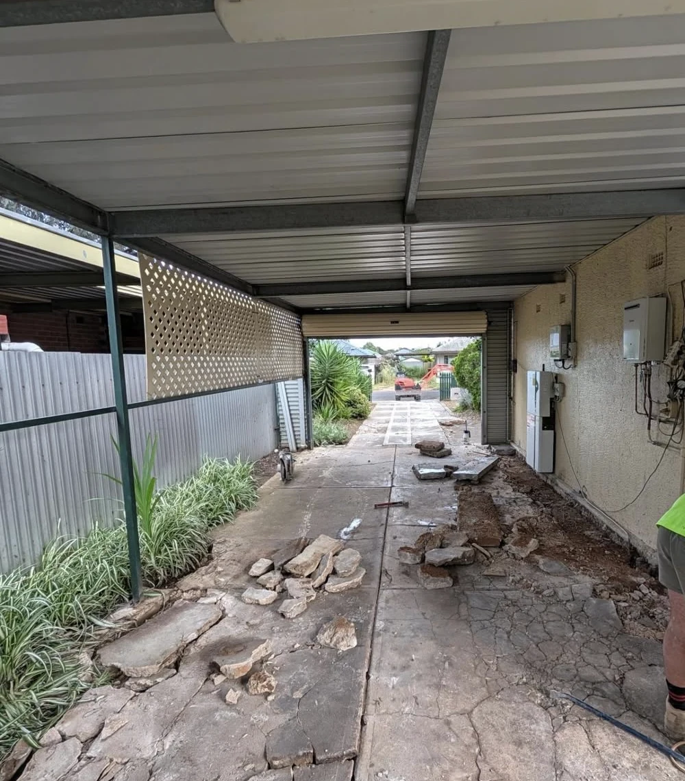 Existing driveway being removed before a replacement concrete driveway
