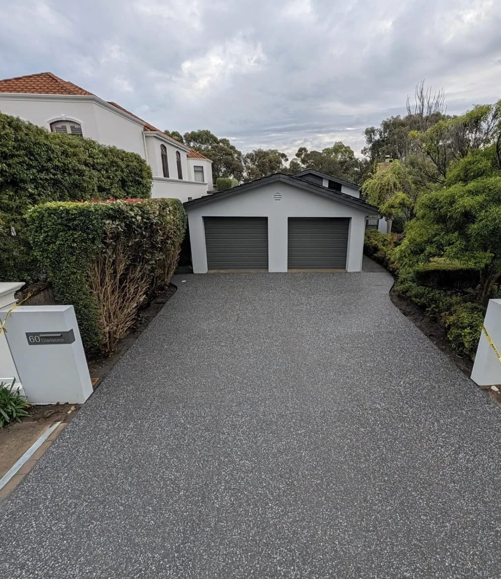 Exposed aggregate driveway and entry at a Brighton home