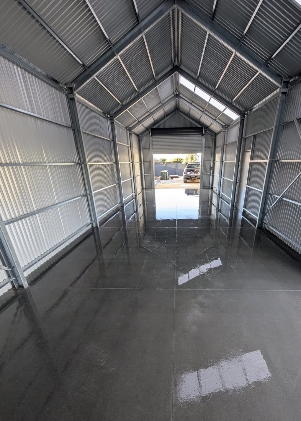 Burnished concrete floor inside a Thompson Beach shed